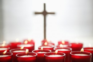 Religious Candles and Cross --- Image by © Royalty-Free/Corbis